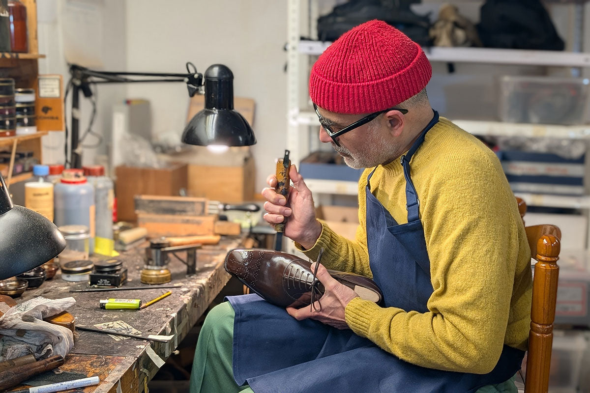 norman vilalta working on a handmade shoe in our workshop in barcelona, spain